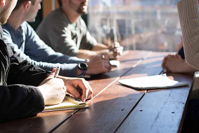 a picture of business professionals interviewing for a Sales Engineer role and conducting an interview